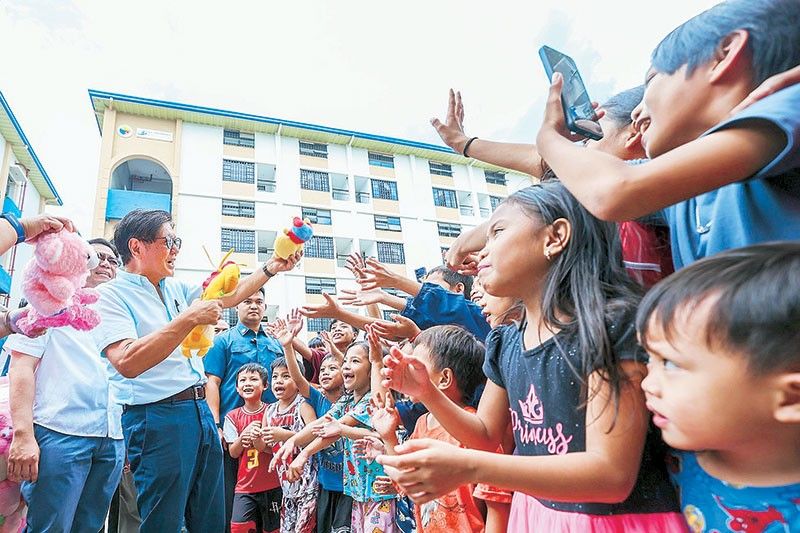 Marcos turns over 333 houses to Valenzuela beneficiaries