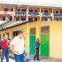 The Philippine flag flies at half-mast in front of the main building of Banga National High School in Banga, South Cotabato on September 19, 2026, a day after the shooting that left three students dead and eight others wounded. Inset shows Education Secretary Sonny Angara visiting the scene of the shooting, calling on local governments and communities to help schools strengthen their security. 