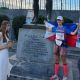 With the Philippine flag, Jennifer Uy poses before the statue of King Leonidas in Sparta, Greece, celebrating her status as the first Filipina to conquer the grueling Spartathlon.