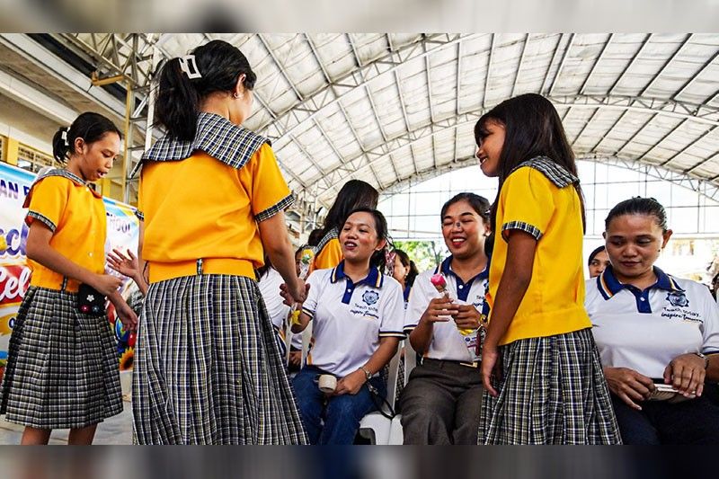 Marcos vows better benefits, career growth for teachers