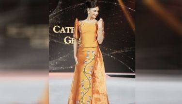 Catriona Gray stands out in a terno by Wilson Limon.
