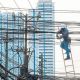 A Meralco lineman repairs an electrical line along Jupiter Street in Makati in this file photo from March.